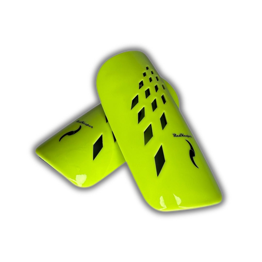 Canilleras de futbol amarillo fluor