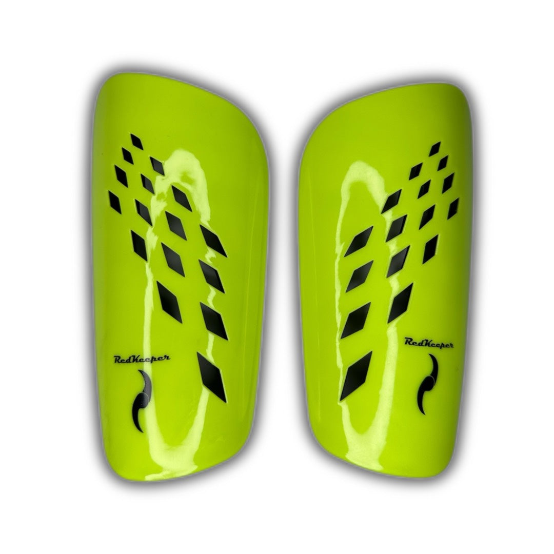 Canilleras de futbol amarillo fluor